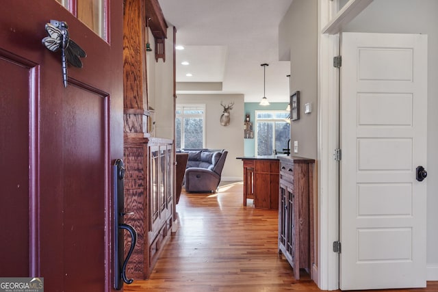 hallway featuring recessed lighting and wood finished floors