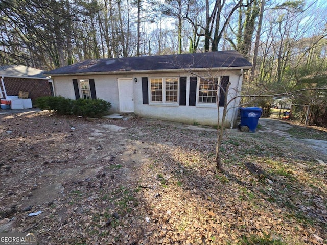 view of front of house featuring brick siding