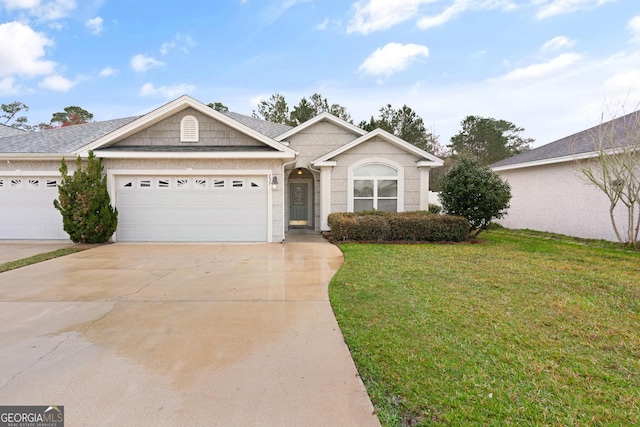 ranch-style home with an attached garage, driveway, and a front lawn