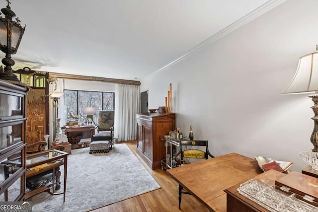 office area featuring ornamental molding and wood finished floors