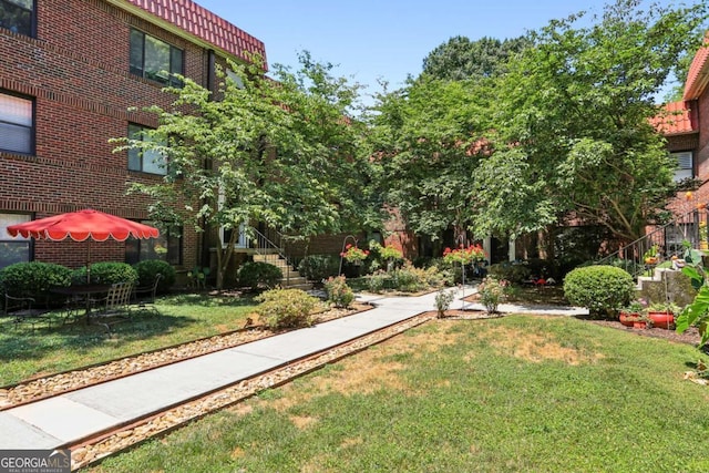 view of property's community with a yard