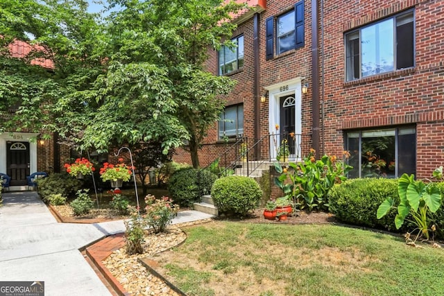 exterior space with brick siding