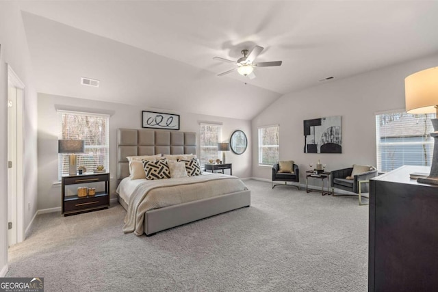 carpeted bedroom with lofted ceiling, visible vents, and baseboards