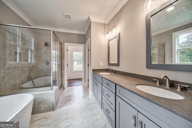 104 Bob White Dr, Calhoun, GA 30701 - full bath featuring tile patterned floors, crown molding, a freestanding tub, double vanity, and healthy amount of natural light