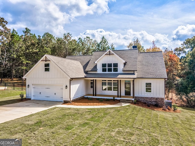104 Bob White Dr, Calhoun, GA 30701 - modern inspired farmhouse with a shingled roof, board and batten siding, covered porch, driveway, and a chimney