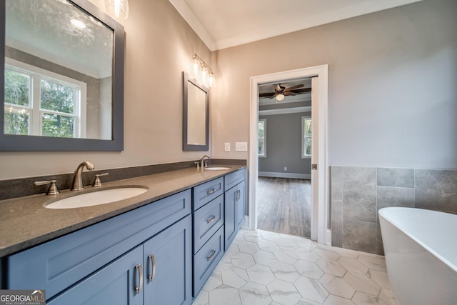 104 Bob White Dr, Calhoun, GA 30701 - full bath featuring plenty of natural light, a freestanding bath, double vanity, tile patterned floors, and tile walls