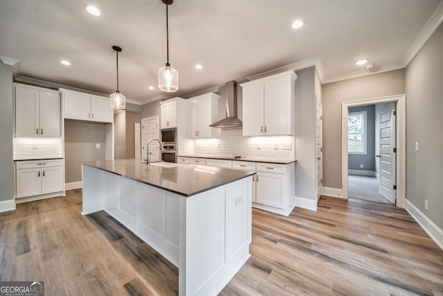 104 Bob White Dr, Calhoun, GA 30701 - kitchen with wall chimney exhaust hood, ornamental molding, backsplash, white cabinets, and dark countertops