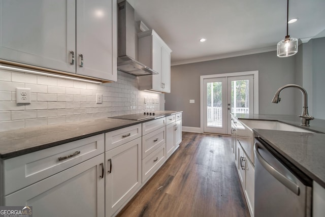 kitchen with tasteful backsplash, wall chimney range hood, ornamental molding, stainless steel dishwasher, and a sink