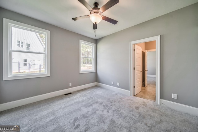 104 Bob White Dr, Calhoun, GA 30701 - unfurnished bedroom featuring carpet and a ceiling fan
