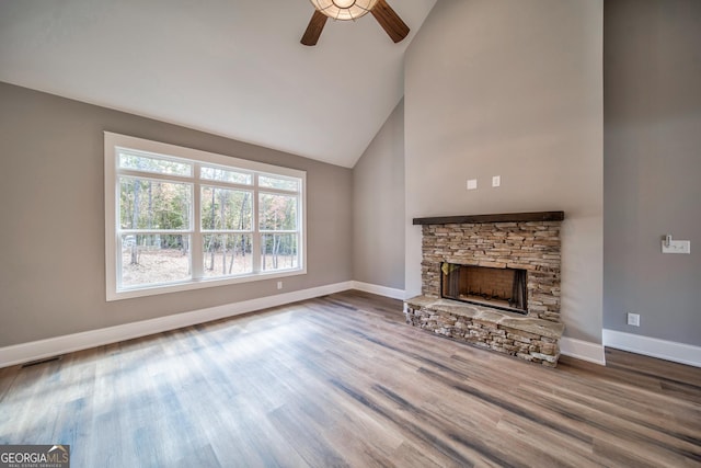 104 Bob White Dr, Calhoun, GA 30701 - unfurnished living room featuring a ceiling fan, wood finished floors, high vaulted ceiling, and a fireplace