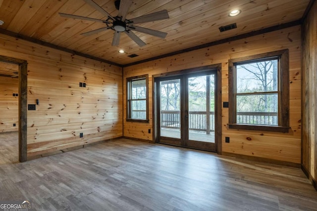 entryway featuring french doors, wood walls, wood finished floors, and wood ceiling