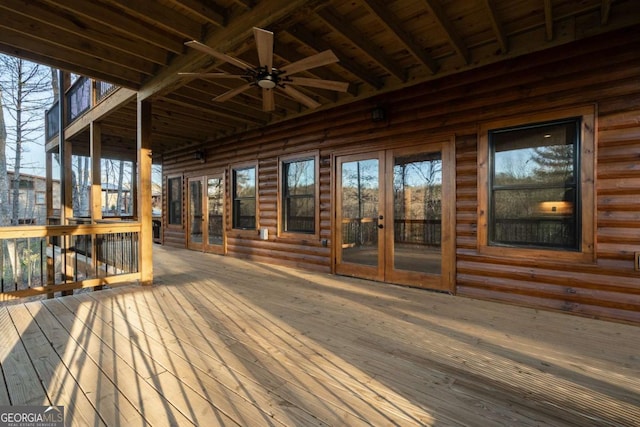 deck with french doors and a ceiling fan