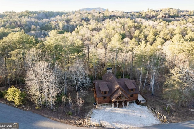 drone / aerial view with a view of trees