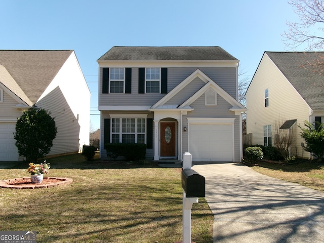 view of front of property featuring driveway, a garage, and a front lawn