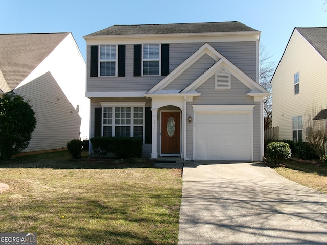 view of front of home featuring concrete driveway, an attached garage, and a front lawn