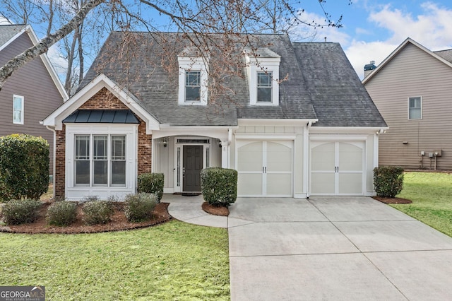 view of front of property with an attached garage, brick siding, driveway, roof with shingles, and a front yard