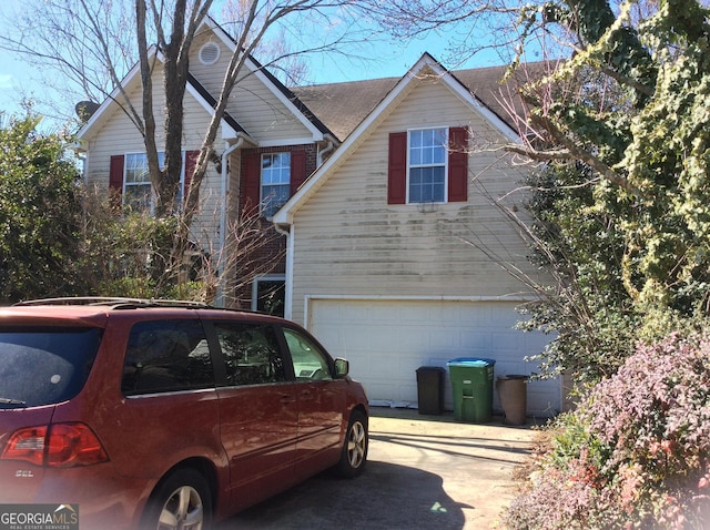 view of home's exterior featuring driveway