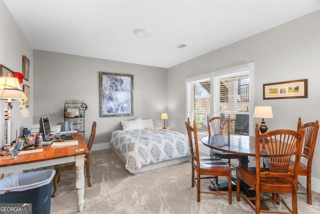 bedroom with carpet floors, visible vents, and baseboards