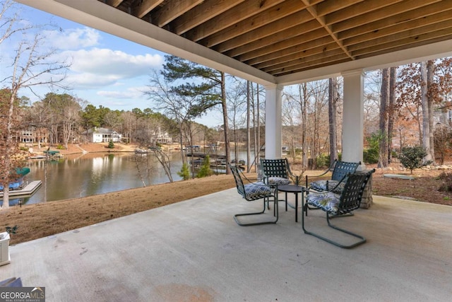 view of patio with a water view