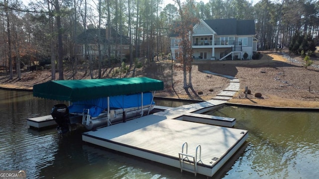 dock area featuring a water view and stairway