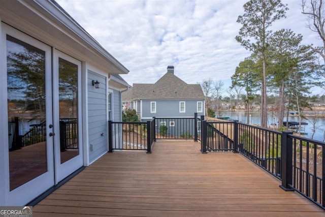 wooden terrace with a water view