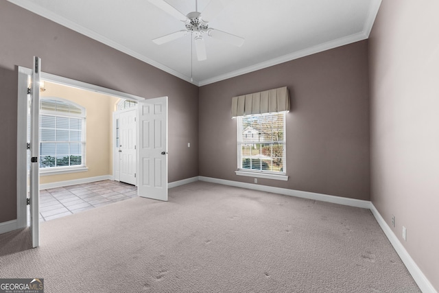 unfurnished bedroom with ornamental molding, carpet flooring, baseboards, and tile patterned floors