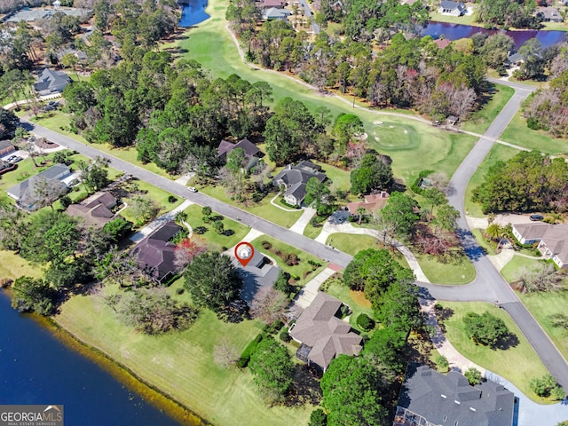 bird's eye view featuring a water view, view of golf course, and a residential view