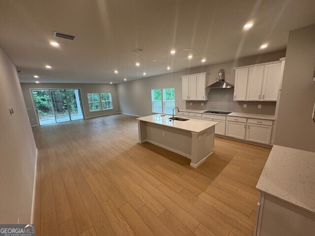 203 Park View Ln, Kingsland, GA 31548 - kitchen with a sink, wall chimney exhaust hood, open floor plan, black cooktop, and recessed lighting