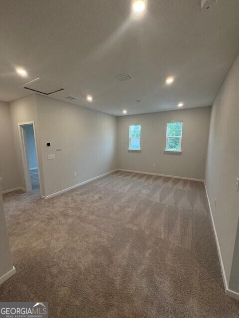 203 Park View Ln, Kingsland, GA 31548 - spare room featuring light colored carpet, baseboards, recessed lighting, and attic access