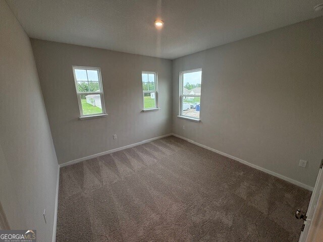 203 Park View Ln, Kingsland, GA 31548 - carpeted empty room featuring baseboards
