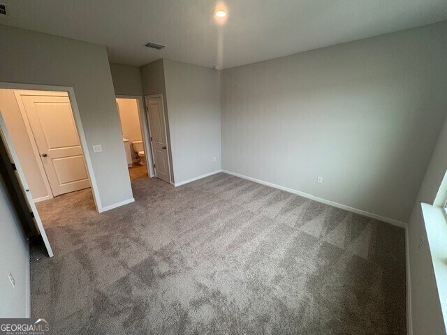 203 Park View Ln, Kingsland, GA 31548 - unfurnished bedroom with carpet and baseboards