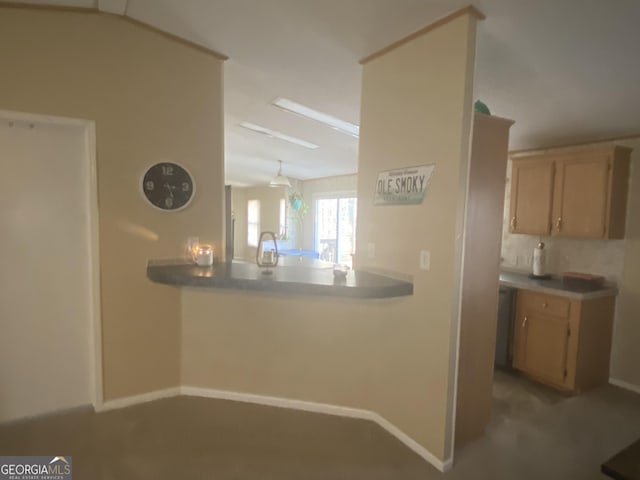 kitchen featuring decorative backsplash, baseboards, and light brown cabinetry