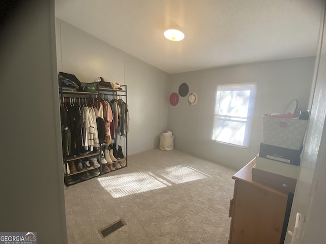 bedroom featuring a closet, carpet, and visible vents