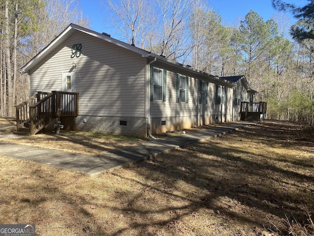 view of side of property with crawl space