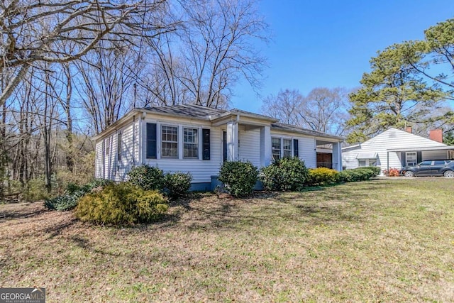 ranch-style house with a front yard