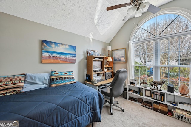 bedroom with lofted ceiling, carpet, a ceiling fan, and a textured ceiling