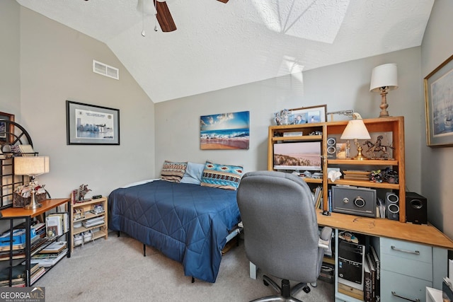 carpeted bedroom featuring ceiling fan, visible vents, vaulted ceiling, and a textured ceiling