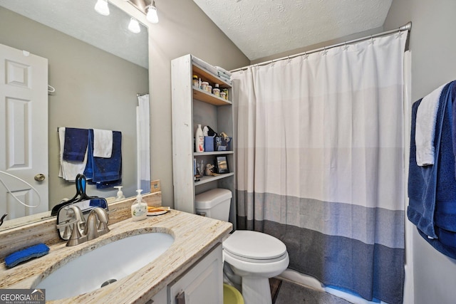 bathroom with a textured ceiling, a shower with shower curtain, vanity, and toilet