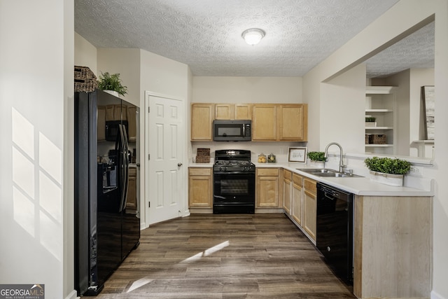 kitchen with dark wood-style flooring, a sink, light countertops, light brown cabinetry, and black appliances