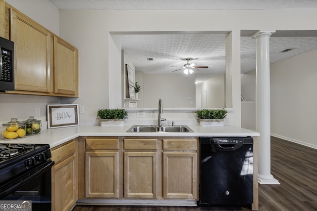 kitchen with a textured ceiling, dark wood-type flooring, a sink, black appliances, and ornate columns