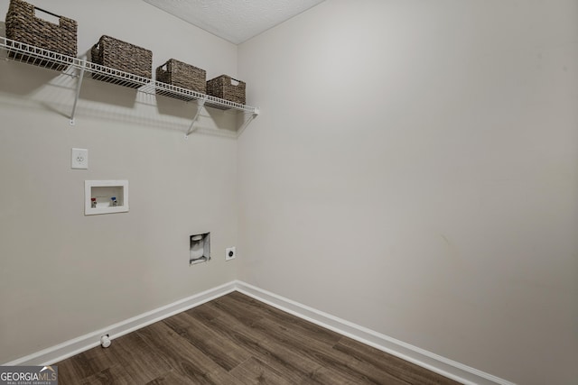 clothes washing area featuring washer hookup, laundry area, electric dryer hookup, and baseboards