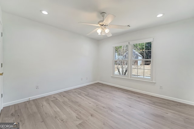 empty room with light wood finished floors, ceiling fan, baseboards, and recessed lighting