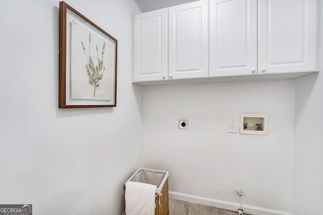 laundry area with cabinet space, baseboards, gas dryer hookup, hookup for a washing machine, and hookup for an electric dryer