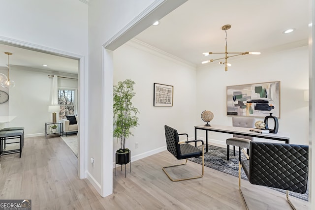 office space with baseboards, an inviting chandelier, wood finished floors, and crown molding