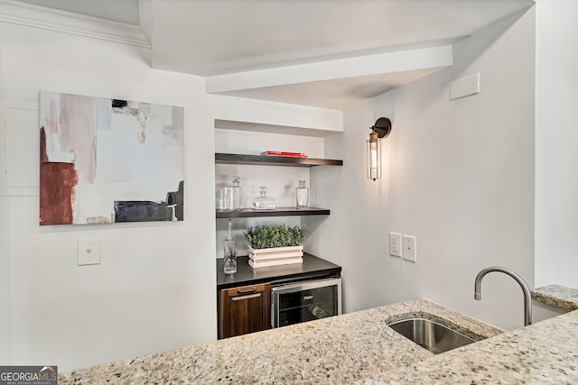 bar with wine cooler, bar, and a sink