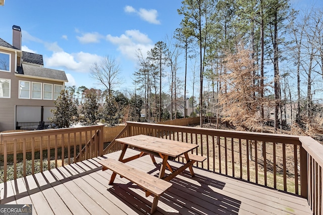 wooden deck with outdoor dining area