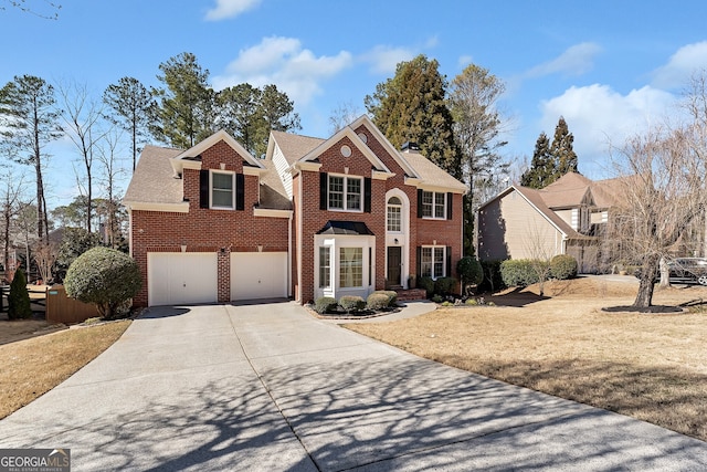 view of front of house featuring driveway, a garage, brick siding, a chimney, and a front yard