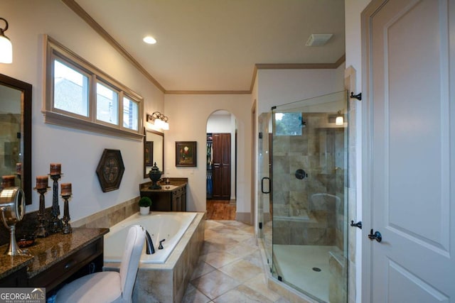 bathroom with vanity, ornamental molding, a bath, tile patterned floors, and a stall shower