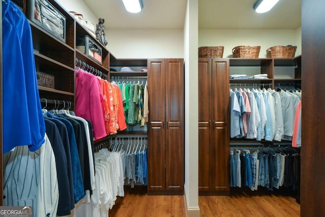 spacious closet with wood finished floors