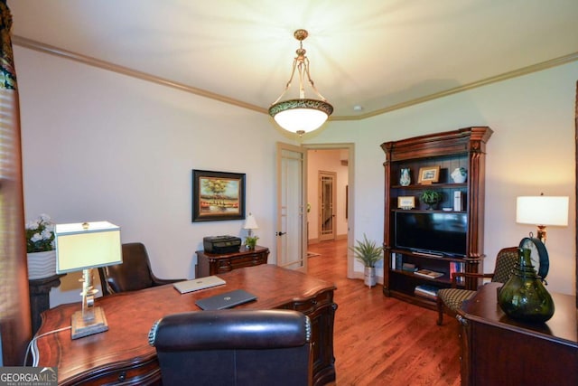 office area with crown molding and wood finished floors